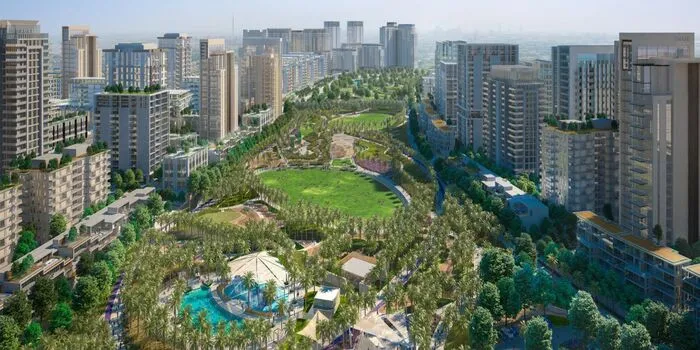 Dubai Hills Estate Park showing families on jogging tracks and cycling paths with landscaped green spaces in the master-planned community