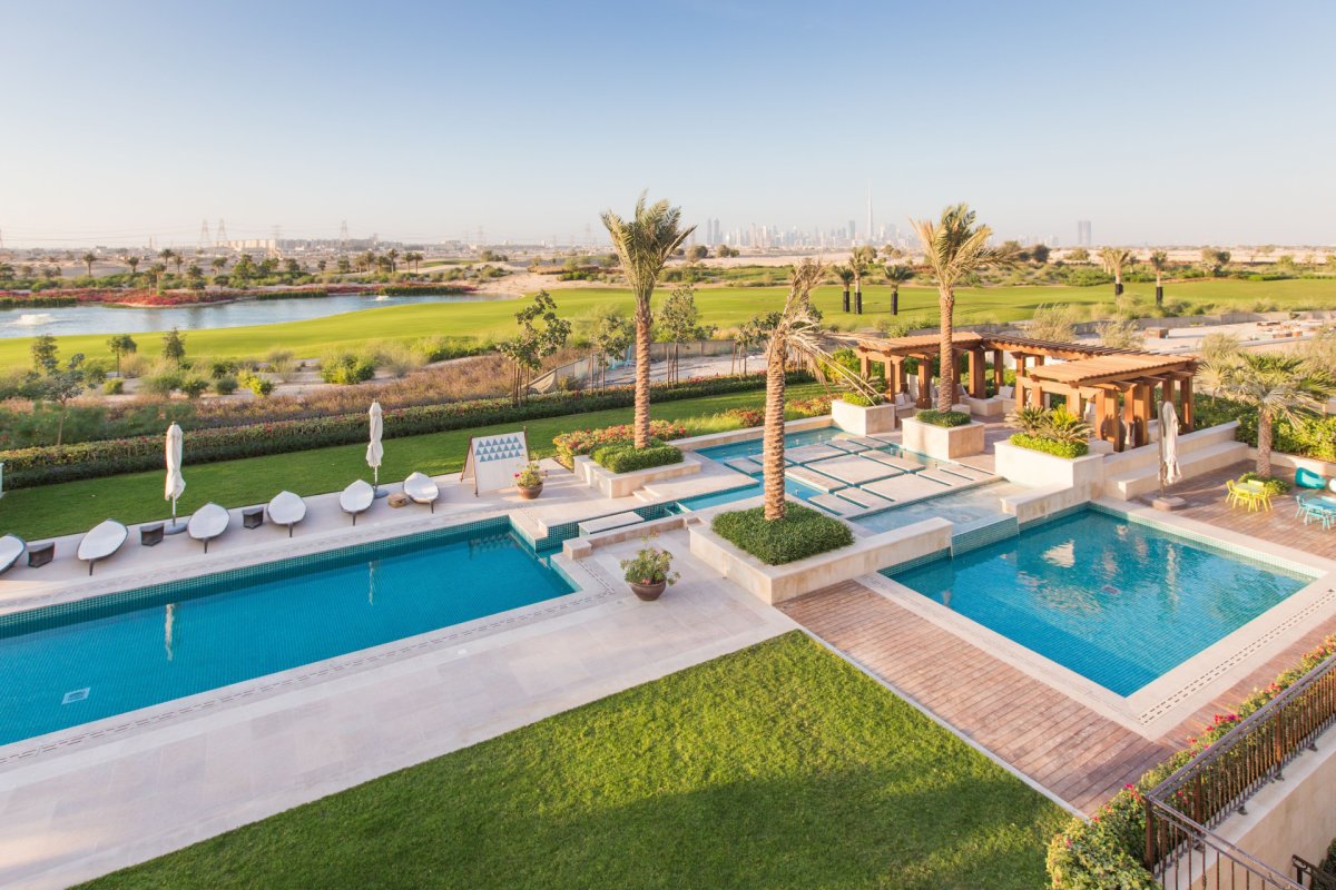 Dubai Hills Estate Sidra Villa exterior with private garden, swimming pool and views of the championship golf course in Mohammed Bin Rashid City