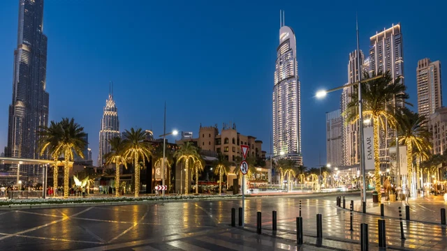 Sheikh Mohammed bin Rashid Boulevard in Downtown Dubai with outdoor restaurant terraces and cyclists